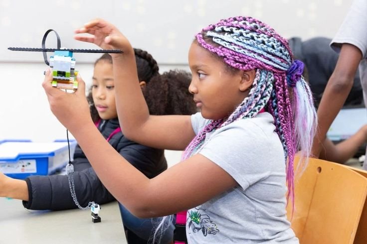 Girls participating in a STEM workshop